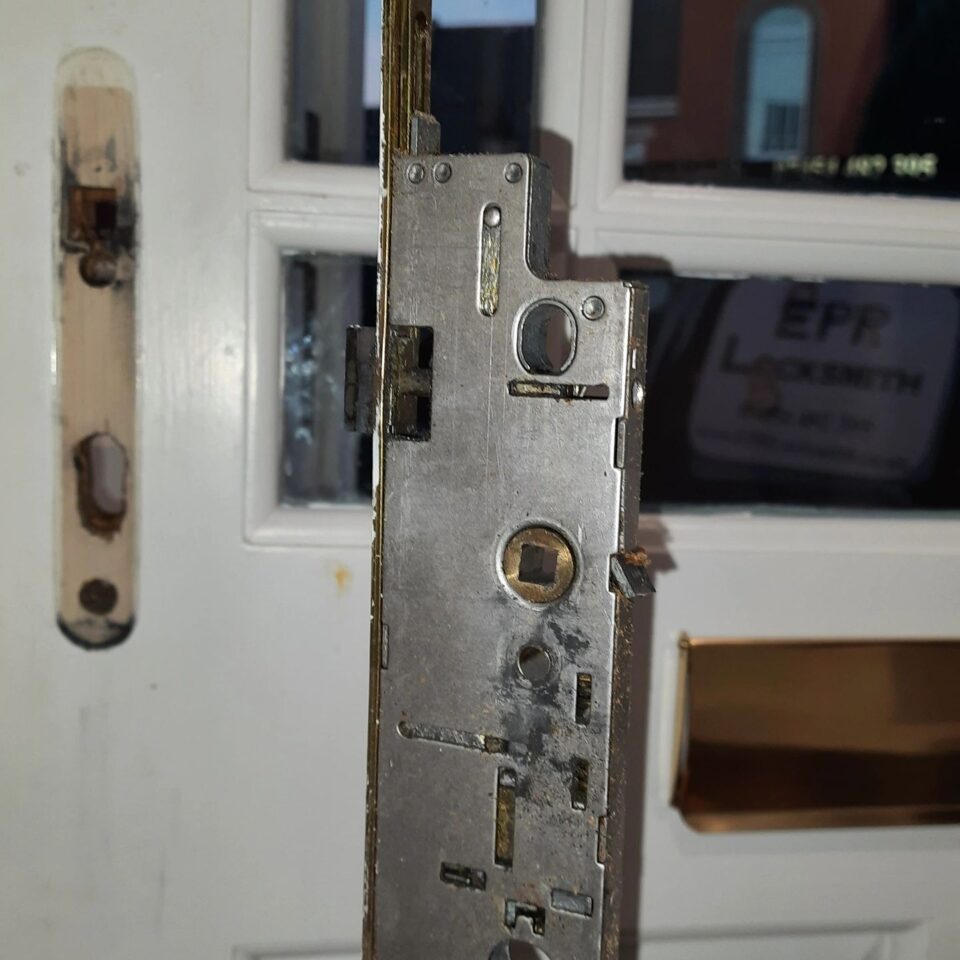 Full-length multipoint locking system replacement on a wooden door in Windsor