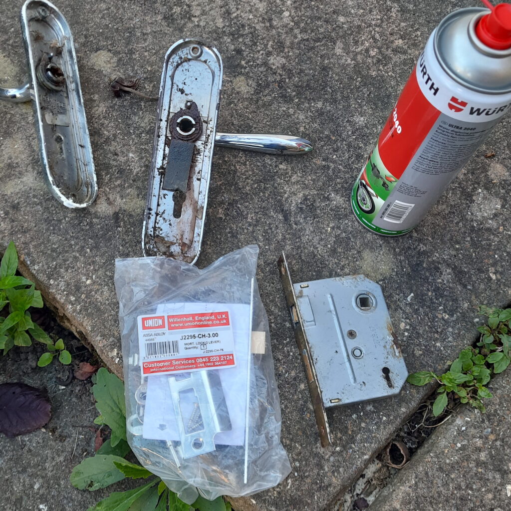 Sashlock replacement on a rust-affected outbuilding door in Walton-on-Thames